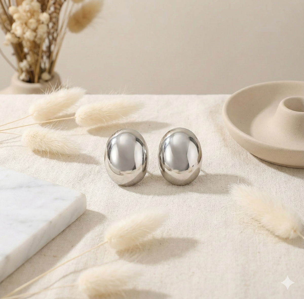 Трендові сріблясті сережки-краплі в стилі Liquid Metal